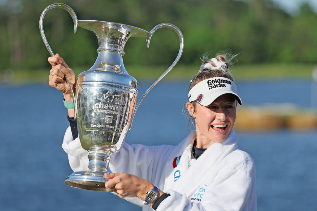 Nelly Korda poses with the Chevron Championship trophy.